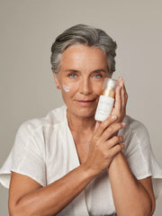 The Ritual of Namaste Ageless Firming Serum Studio with Model and Product
