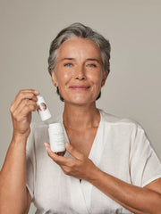 The Ritual of Namaste Ageless Firming Serum Studio with Model and Product