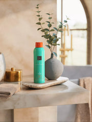 The Ritual of Karma Sun Protection Milky Spray 30 Lifestyle with Product