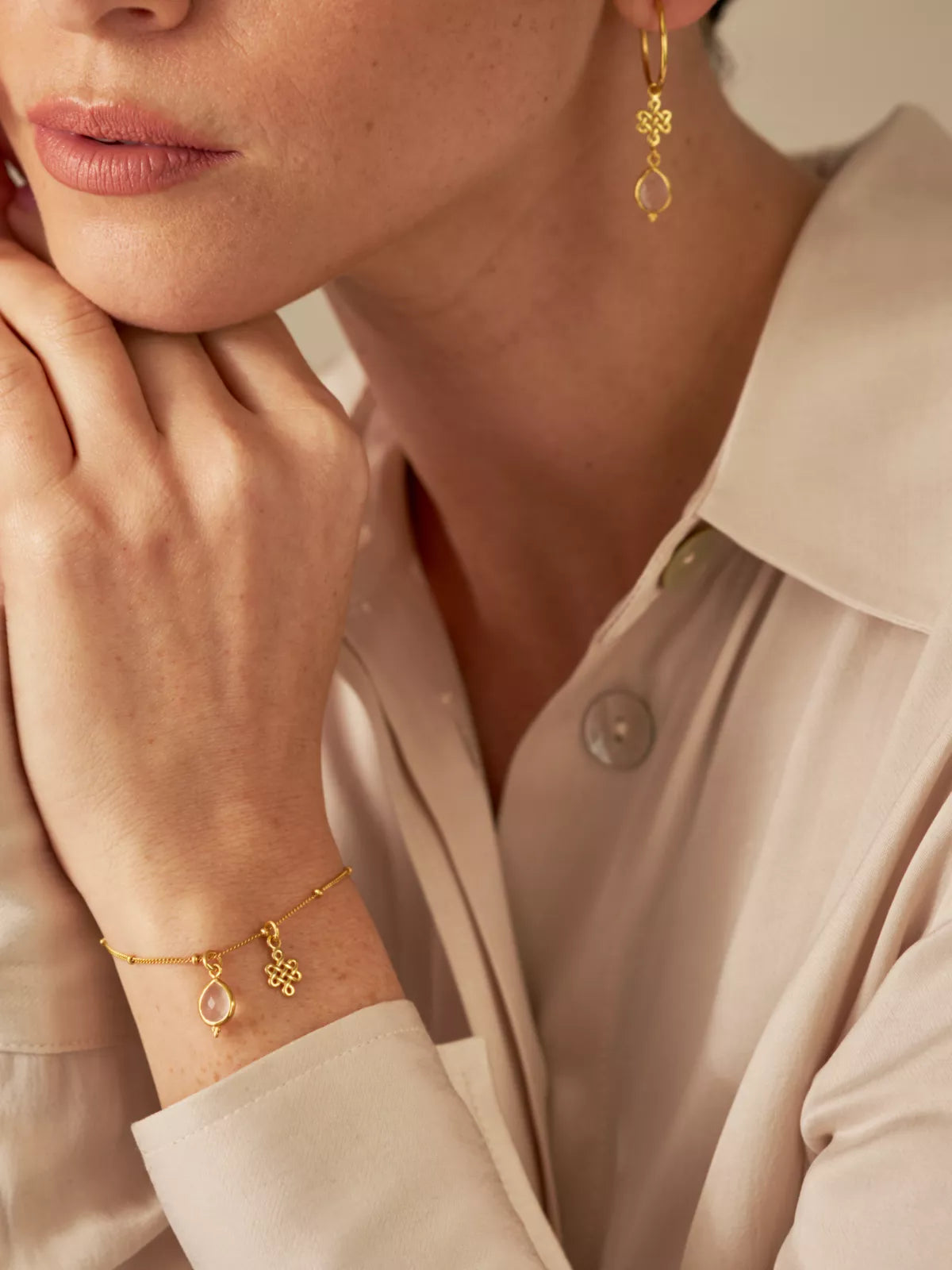 Rose Quartz Infinity Pendant Bracelet Gold Plated Studio with Model and Product